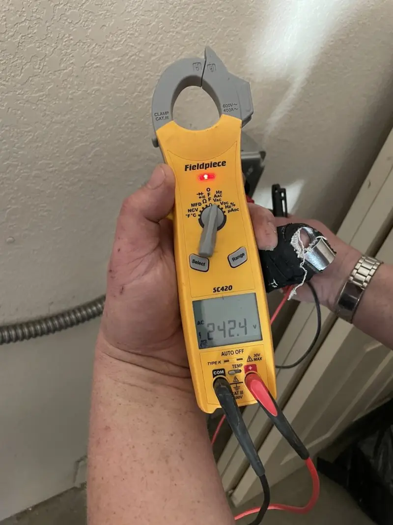 Voltage testing with clamp meter during Hot Tub / Pool Electrical Wiring in Wamego